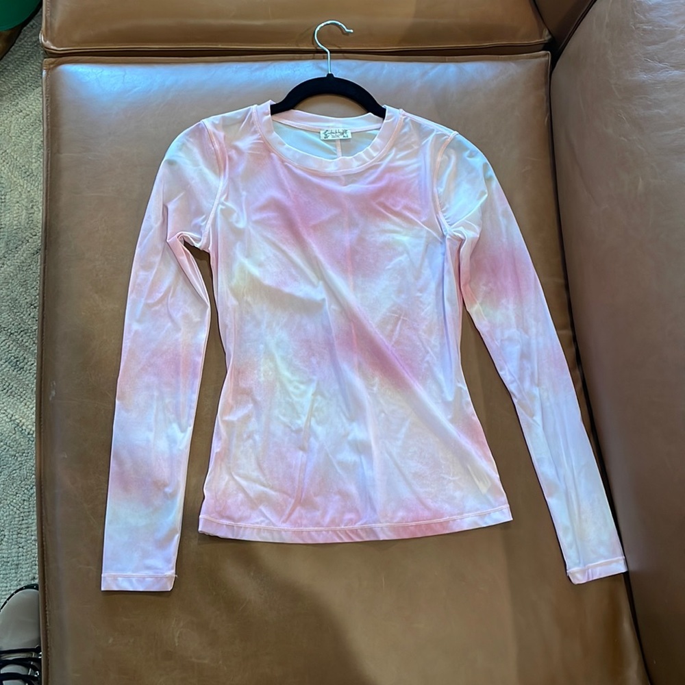 Super cute sheer long sleeve. Would be fun for a concert or night out.